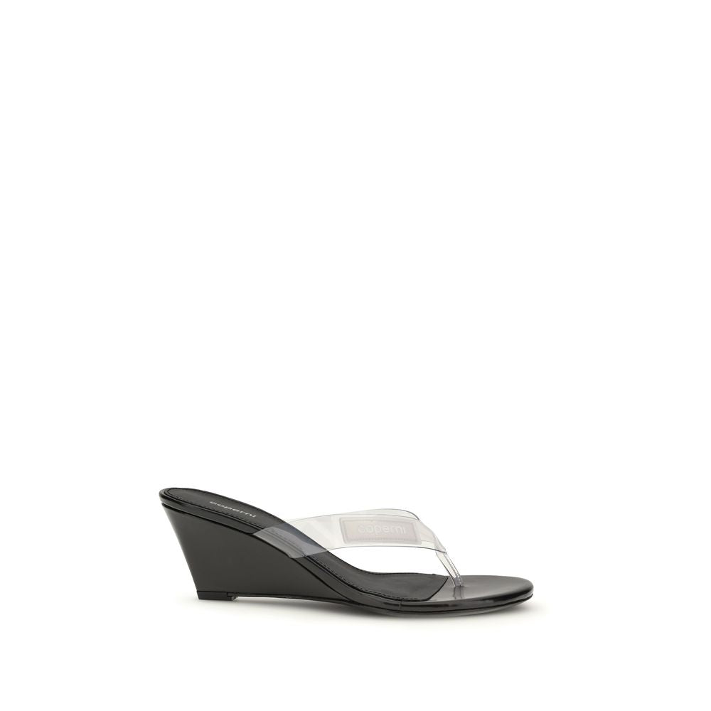 Wedge Flip-Flop Sandals by Coperni for women in pvc black & transparent showcases a sculptural silhouette as Women's PVC Wedge Flip-Flop Sandals, defined by a sculptural wedge and sculptural for a sculptural look.
