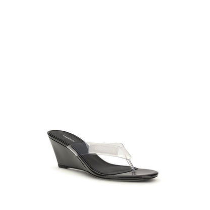 Wedge Flip-Flop Sandals by Coperni for women in pvc black & transparent features an exquisite silhouette, showcasing the exquisite Women's PVC Wedge Flip-Flop Sandals with a wedge and .