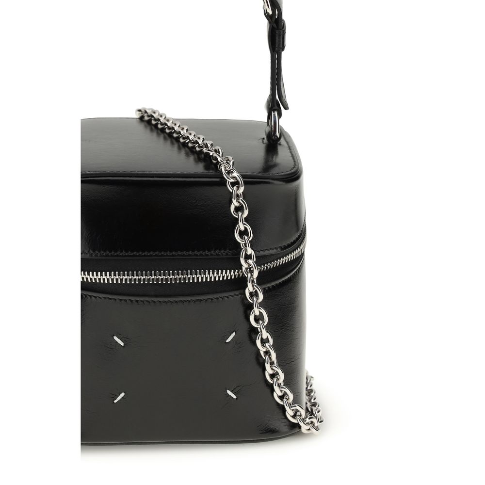 Bucket Shoulder Bag by Maison Margiela for women in bos taurus calf leather black, white & signature features a distinguished silhouette, showcasing a secure zipper and distinguished with versatile shoulder-strap, handle & adjustable-strap for a distinguished finish.