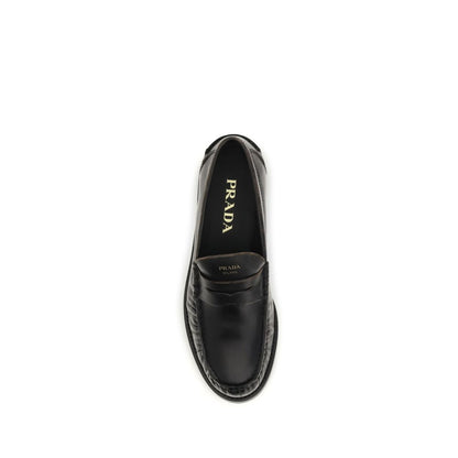 Flat Loafer Slip-On Shoes by Prada for women in bos taurus calf leather black features an dynamic silhouette from the Women's Bos Taurus Calf Leather Flat Loafer Slip-On Shoes collection, defined by a dynamic round toe style and flat for a dynamic look.