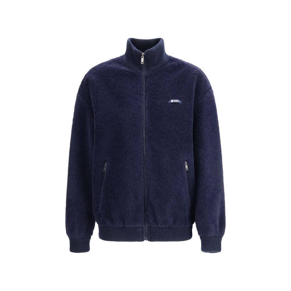 Overcoat by Prada for women in polyamide wool blue & signature showcases a enveloping silhouette, detailed with distinctive pockets and a enveloping .