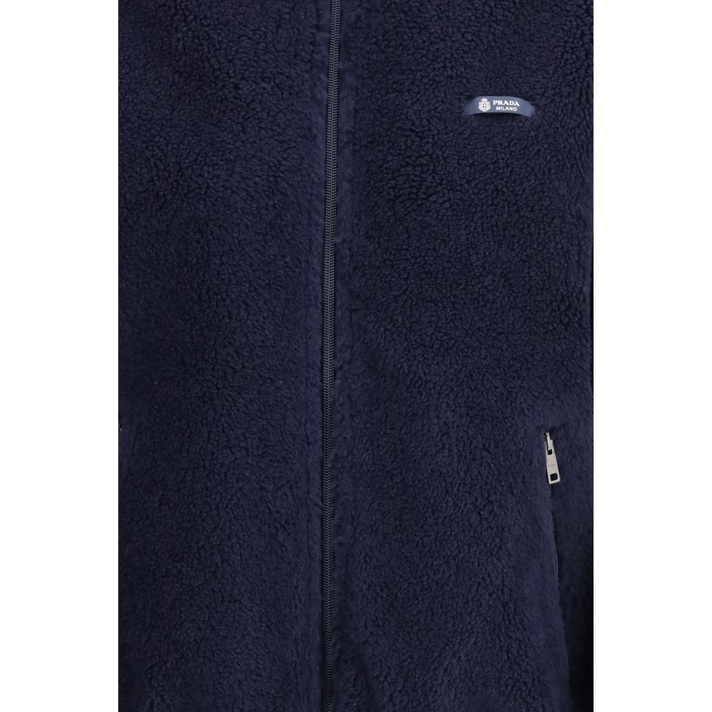 Overcoat by Prada for women in polyamide wool blue & signature features an voluminous silhouette, showcasing distinct pockets and a voluminous for a truly voluminous aesthetic.