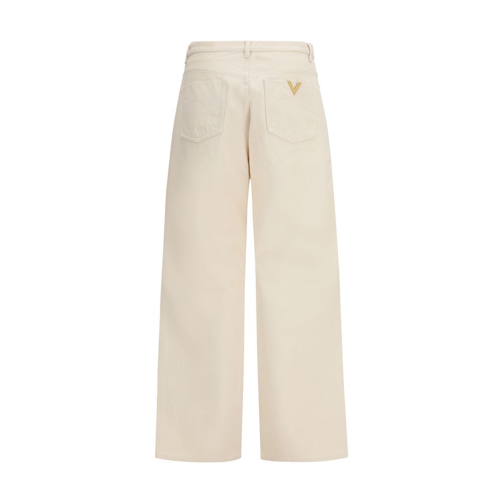 Jeans by Valentino Garavani for men in denim cotton beige & signature features an refined tailoring silhouette, showcasing a premium relaxed-fit & regular-fit with a and long cut for a refined tailoring look.