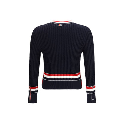 Sweatshirt by Thom Browne for men in cotton blue features an provocated silhouette, detailed with a provocated and a refined v-neck neckline for a sophisticated aesthetic.