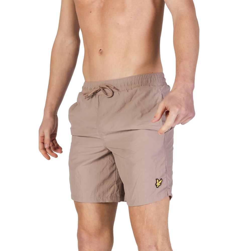 Swim Shorts by Lyle & Scott for men in nylon beige features an glamourous silhouette from the Men's Lightweight Nylon Swim Shorts collection, highlighting a refined fit and glamourous cut for a premium poolside look.