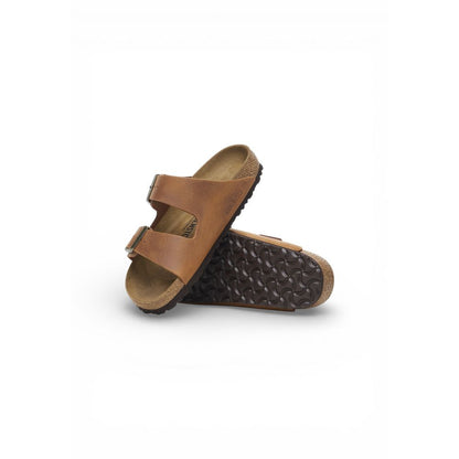 Flat Sandals by Birkenstock for men in leather & cork brown features an statuesque silhouette from the Men's Lightweight Leather & Cork Flat Sandals collection, showcasing a statuesque flat and elegant .
