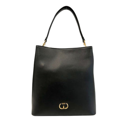 Shoulder Clutch Handbag by Twinset for women in polyurethane black & gold features a sculptural silhouette with a secure magnetic & button, organized built-in-compartments, and versatile shoulder-strap & adjustable-strap for a sculptural finish.
