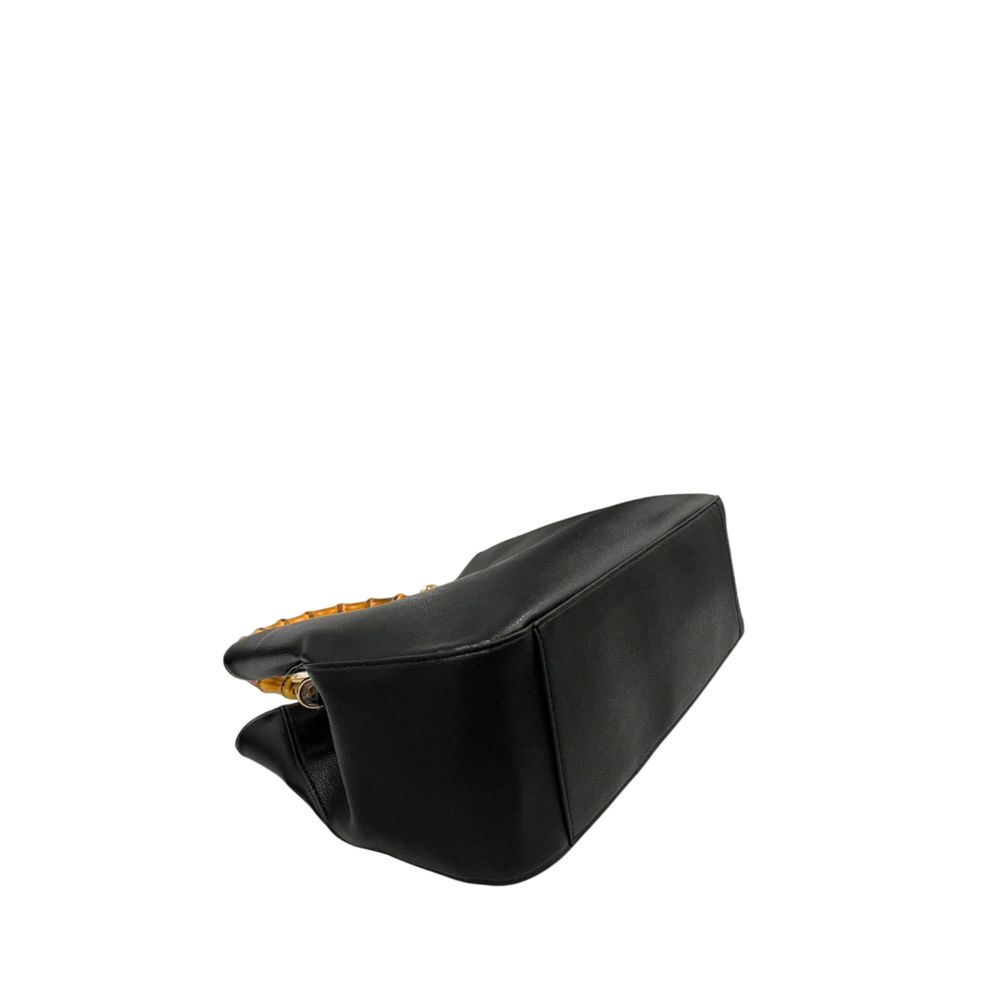 Flap Shoulder Bag by Twinset for women in polyurethane black & gold showcases a statuesque silhouette, artfully detailed with a secure flap, magnetic & button, organized built-in-compartments, and versatile shoulder-strap & adjustable-strap for a statuesque look.