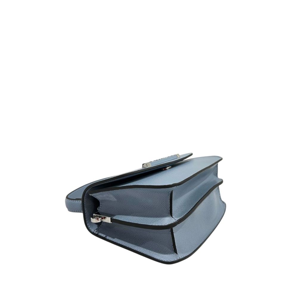 Mini Flap Shoulder Bag by Twinset for women in polyurethane blue & silver presents a statuesque silhouette, showcasing a secure flap, magnetic & button and statuesque with versatile shoulder-strap & adjustable-strap for a sophisticated look.