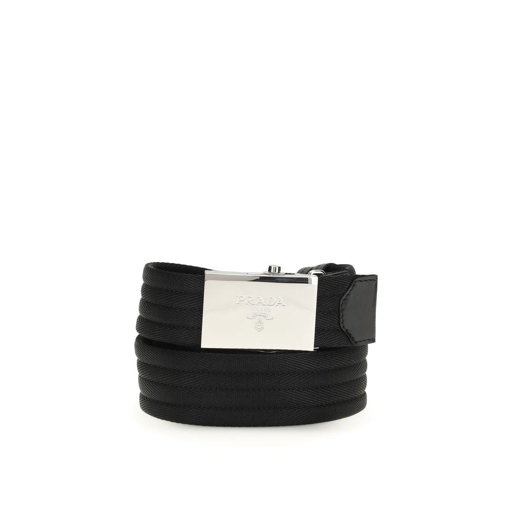 Belt by Prada for men in polyester & nylon black & striped features an artisanal finish, elegantly showcasing the signature style and artisanal craftsmanship of the Polyester & Nylon Belt design.