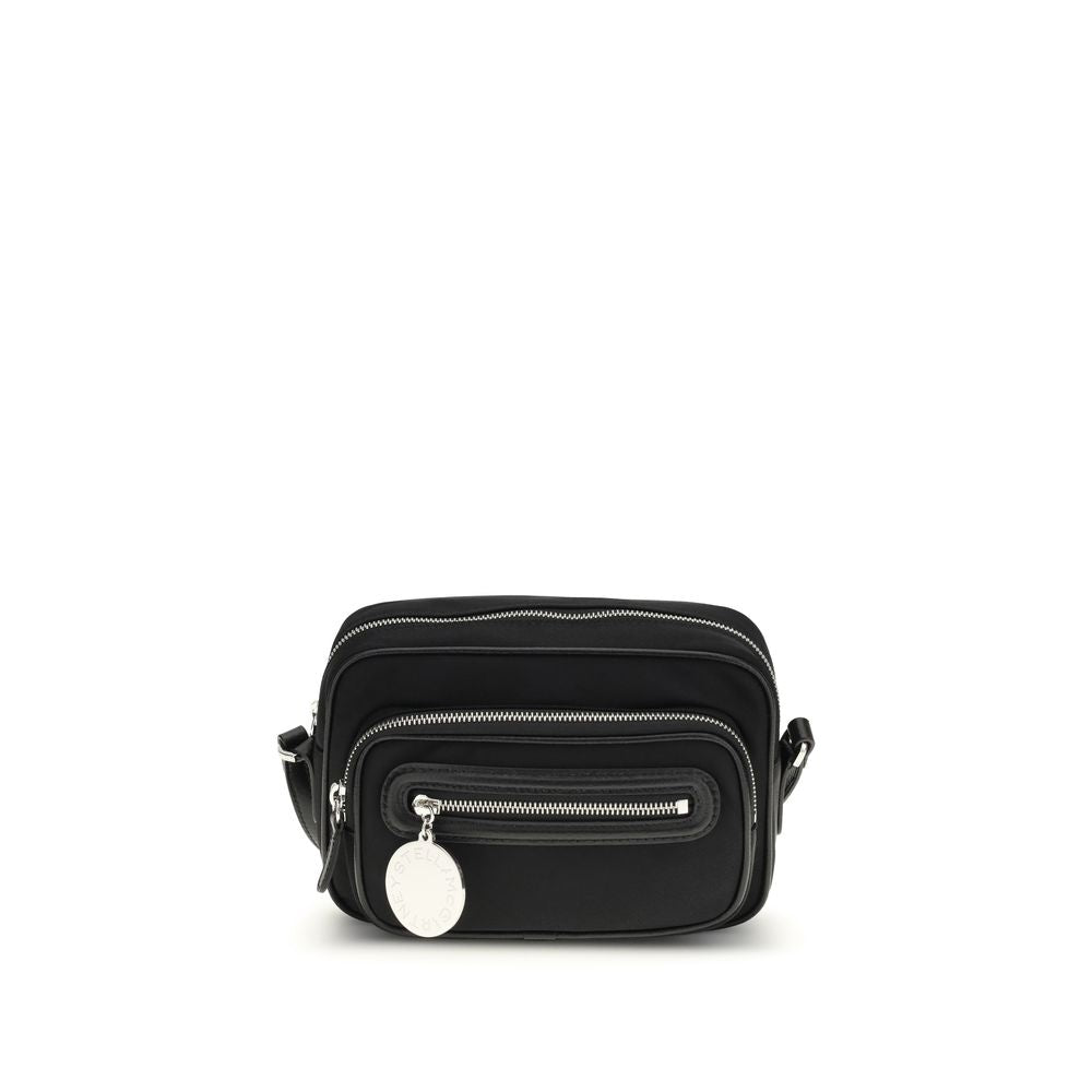 Shoulder Backpack by Stella McCartney for women in polyamide faux leather black & silver features a utilitarian chic Dartmoor Polyamide Faux Leather Shoulder Backpack design with a secure zipper, ample external-pockets, and versatile shoulder-strap, handle, backpack-strap & adjustable-strap for a utilitarian chic finish.