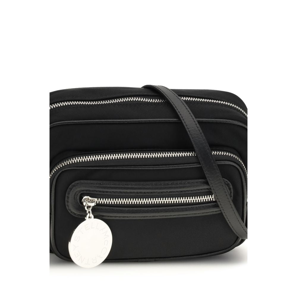 Shoulder Backpack by Stella McCartney for women in polyamide faux leather black & silver features a utilitarian chic Dartmoor Polyamide Faux Leather Shoulder Backpack design with a secure zipper, ample external-pockets, and versatile shoulder-strap, handle, backpack-strap & adjustable-strap for a utilitarian chic finish.