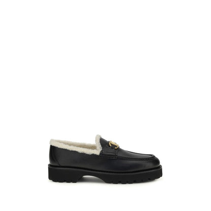Flat Loafer Slip-On Shoes by Valentino Garavani for women in bost taurus calf leather & fur black showcases a resplendent V Logo Women's Bost Taurus Calf Leather & Fur Flat Loafer Slip-On Shoes aesthetic, defined by its resplendent round toe style and elegant flat.