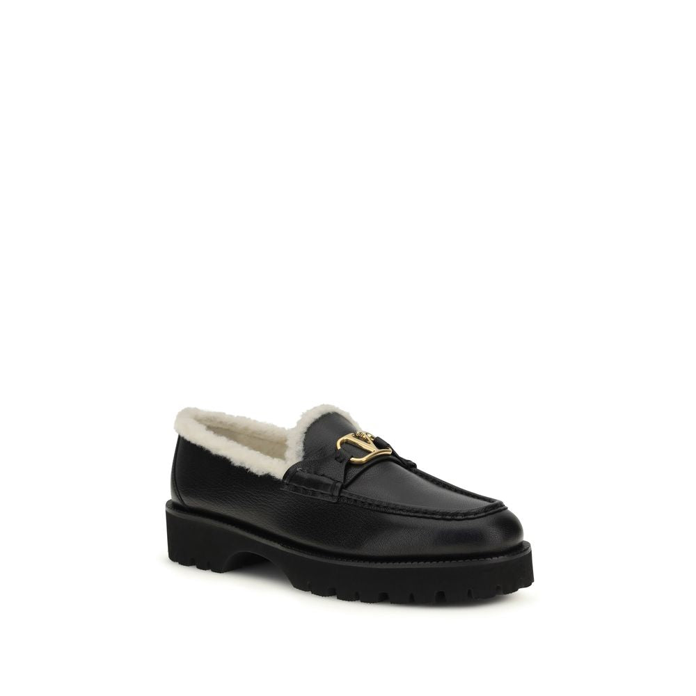 Flat Loafer Slip-On Shoes by Valentino Garavani for women in bost taurus calf leather & fur black showcases a impeccable silhouette as V Logo Women's Bost Taurus Calf Leather & Fur Flat Loafer Slip-On Shoes, artfully designed with a impeccable flat and refined round toe style for a impeccable finish.