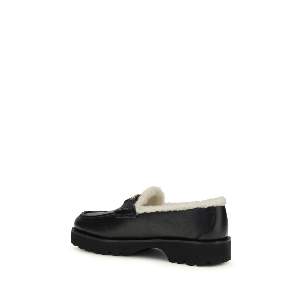 Flat Loafer Slip-On Shoes by Valentino Garavani for women in bost taurus calf leather & fur black features an dynamic silhouette from the V Logo Women's Bost Taurus Calf Leather & Fur Flat Loafer Slip-On Shoes collection, defined by a dynamic round toe style and flat for a dynamic look.