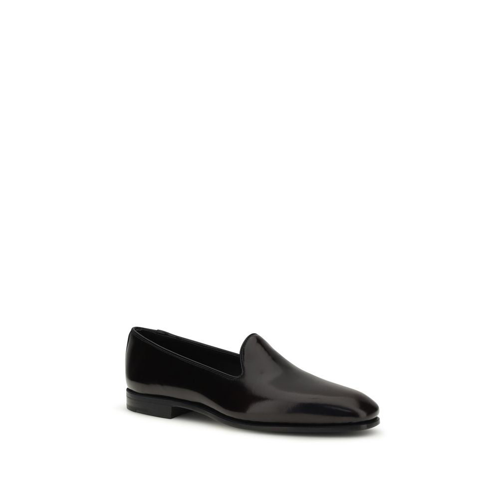 Flat Loafer Slip-On Shoes by Church's for women in bos taurus calf leather black features an ergonomic silhouette, perfectly showcasing Women's Bos Taurus Calf Leather Flat Loafer Slip-On Shoes with its distinct flat and elegant round toe style.