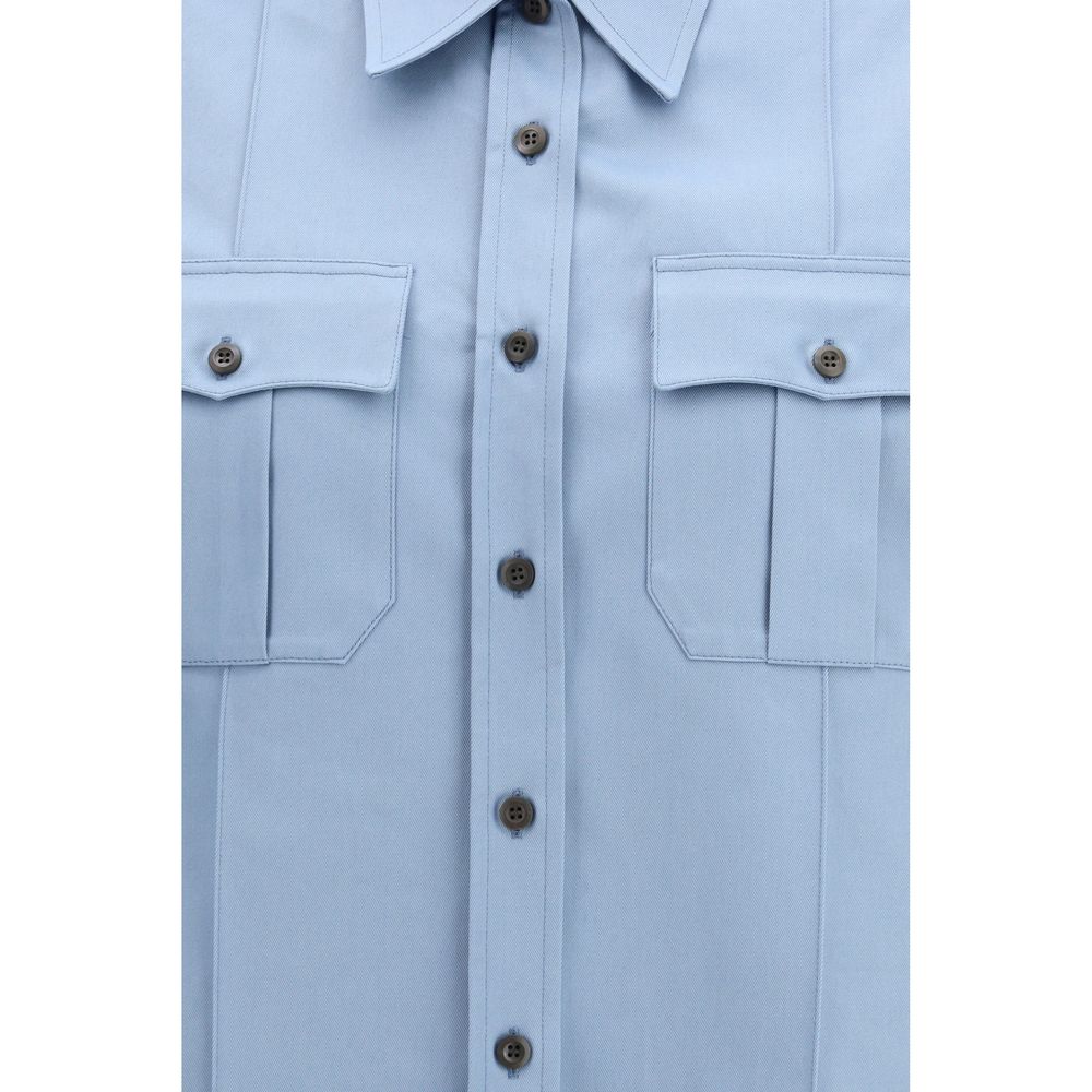 Shirt by Prada for women in cotton blue presents a discerning silhouette, showcasing a sophisticated and for a truly discerning finish.