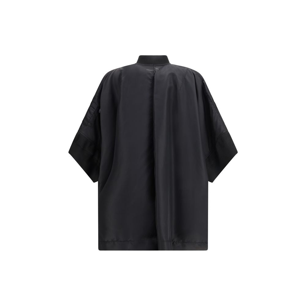 Cape by MM6 for women in polyamide twill black features an relaxed-luxury silhouette, showcasing a sophisticated and premium lightweight & pockets for a truly relaxed-luxury finish.