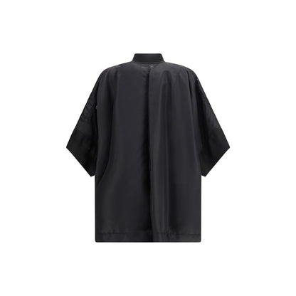 Cape by MM6 for women in polyamide twill black features an relaxed-luxury silhouette, showcasing a sophisticated and premium lightweight & pockets for a truly relaxed-luxury finish.