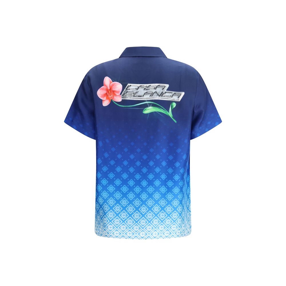 Polo Shirt by Casablanca for women in silk gradient & blue showcases a sharp silhouette, detailed with a refined and sharp for a sophisticated finish.
