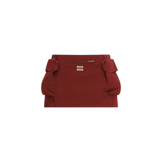 Skirt by Miu Miu for women in cotton bordeaux & signature features an relaxed-yet-refined silhouette that elegantly showcases the Women's Cotton Mini Skirt design and sophisticated mini.