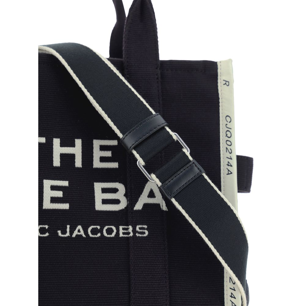 This Medium Tote Handbag by Marc Jacobs for women in cotton polyester and black, jacquard, signature, monogram & print presents a sculptural silhouette featuring a secure zipper, ample , and versatile shoulder-strap, handle & adjustable-strap for a sculptural finish.