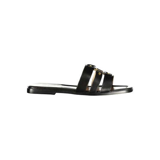 Flat Sandals by Twinset for women in polyurethane leather and black presents a sculptural silhouette, showcasing the signature style of the Essence Women's Polyurethane Leather Flat Sandals with a sculptural flat and sculptural .