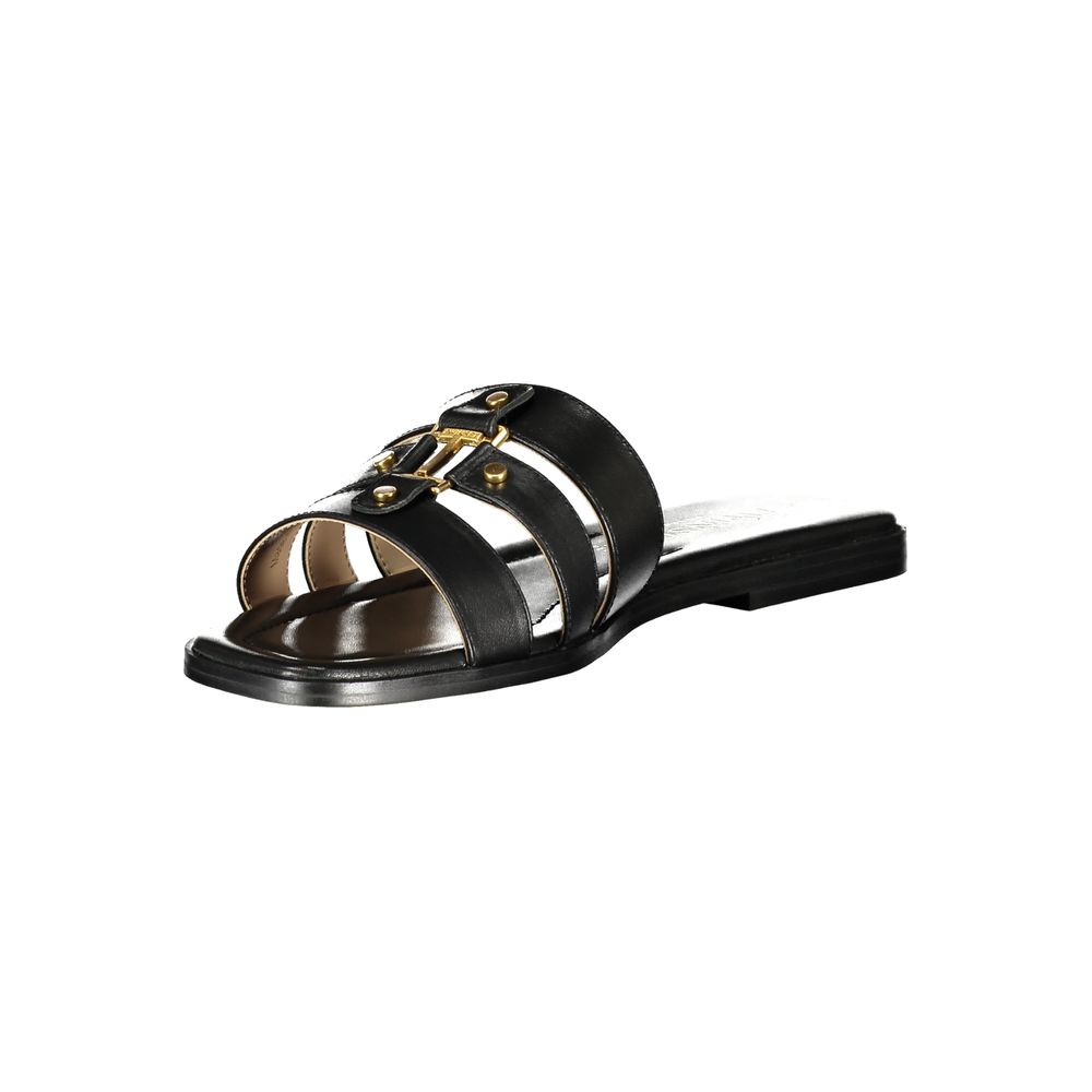 Flat Sandals by Twinset for women in polyurethane leather and black presents a sculptural silhouette, showcasing the signature style of the Women's Polyurethane Leather Flat Sandals with a sculptural flat and sculptural .