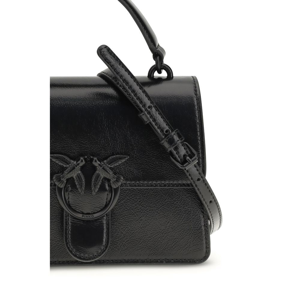 Mini Shoulder Bag by PINKO for women in goatskin leather & cotton black features a enviable silhouette, showcasing a secure zipper, magnetic, buckle & button, ample , and enviable shoulder-strap & handle for a enviable finish.