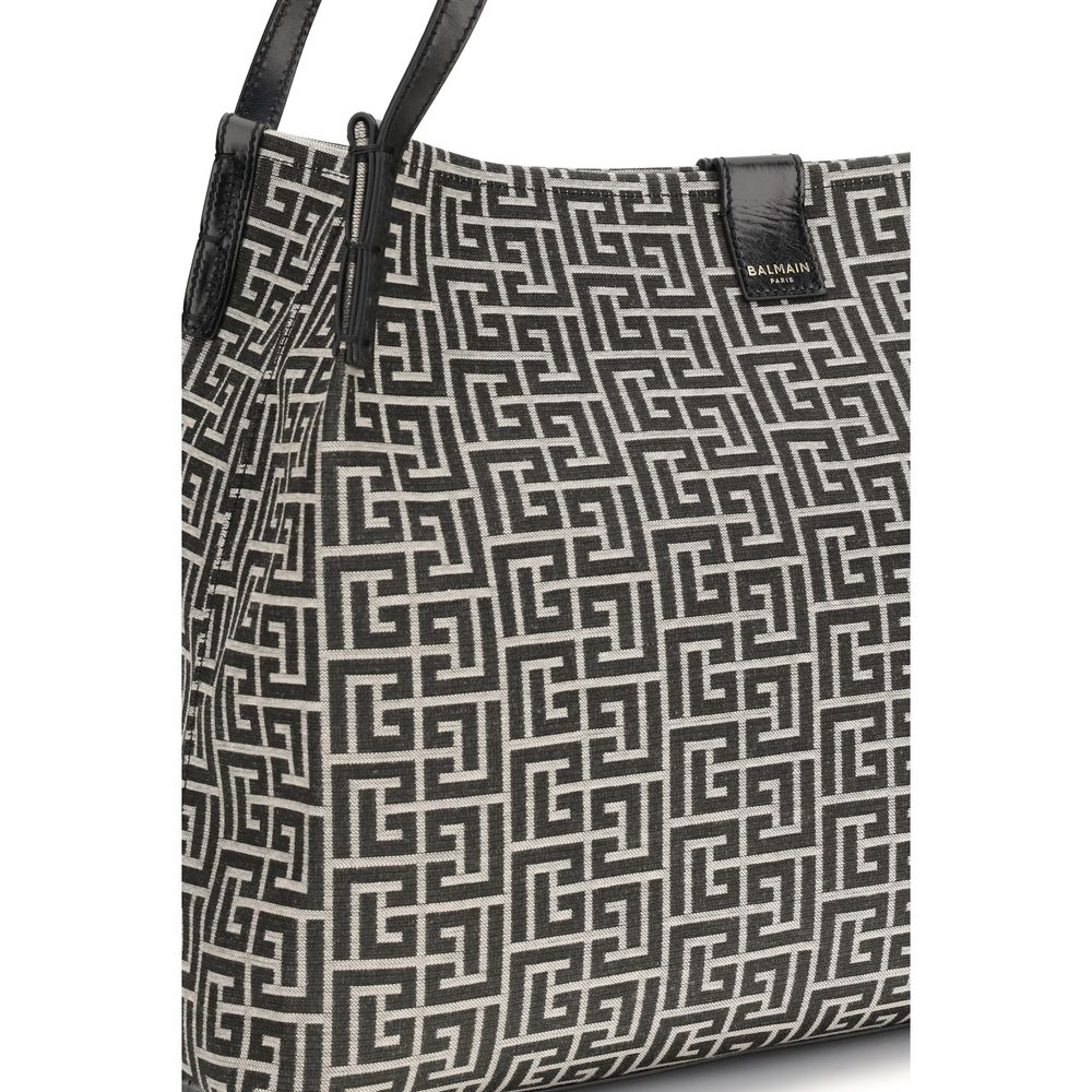 Medium Tote Shoulder Bag by Balmain for women in polyamide polyurethane polyester cotton black features an effortlessly chic silhouette with a secure snap & button, ample , and versatile adjustable-strap for effortlessly chic everyday luxury.
