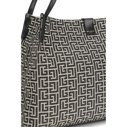 Medium Tote Shoulder Bag by Balmain for women in polyamide polyurethane polyester cotton black features an effortlessly chic silhouette with a secure snap & button, ample , and versatile adjustable-strap for effortlessly chic everyday luxury.