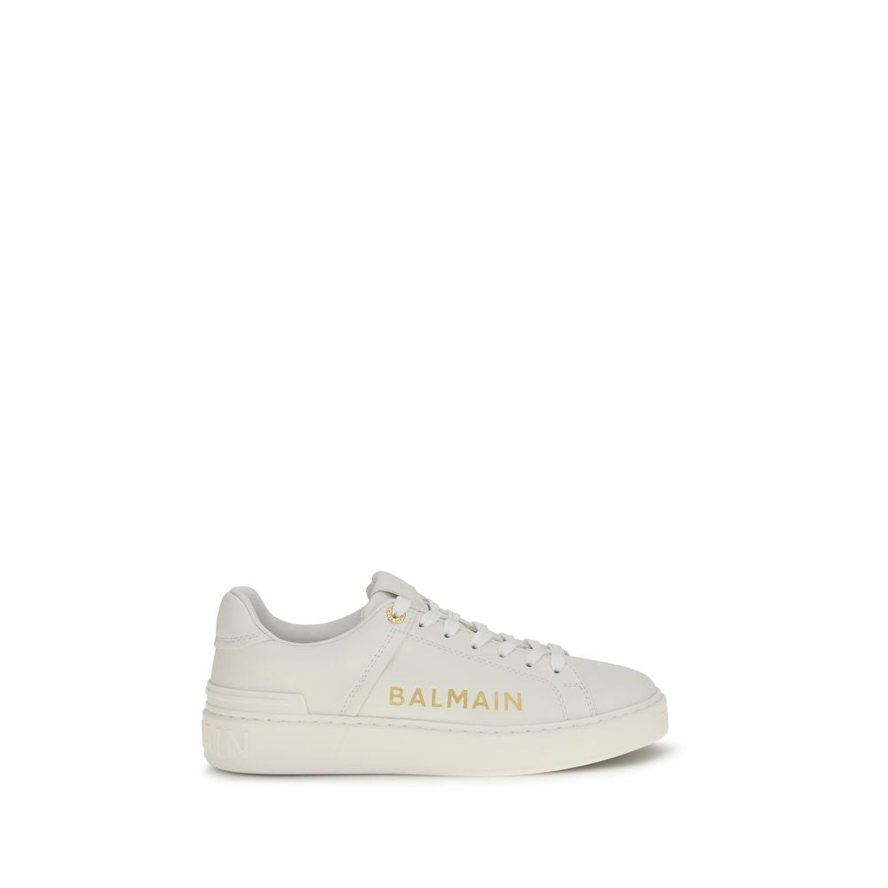 Sneakers by Balmain for women in bos taurus calf leather white presents a sumptuous silhouette, artfully capturing the essence of the Women's Low Top Bos Taurus Calf Leather Sneakers with its sumptuous low-top style design.