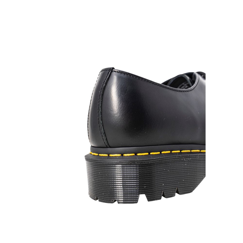 Shoes by Dr. Martens for men in pvc black showcases a timeless silhouette from the Men's PVC Shoes collection, featuring a timeless and for a timeless finish.