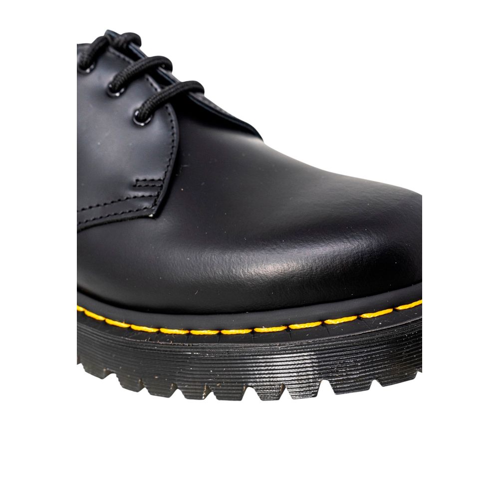 Shoes by Dr. Martens for men in pvc black showcases a timeless silhouette as Men's PVC Shoes, artfully designed with a timeless and refined for a timeless finish.