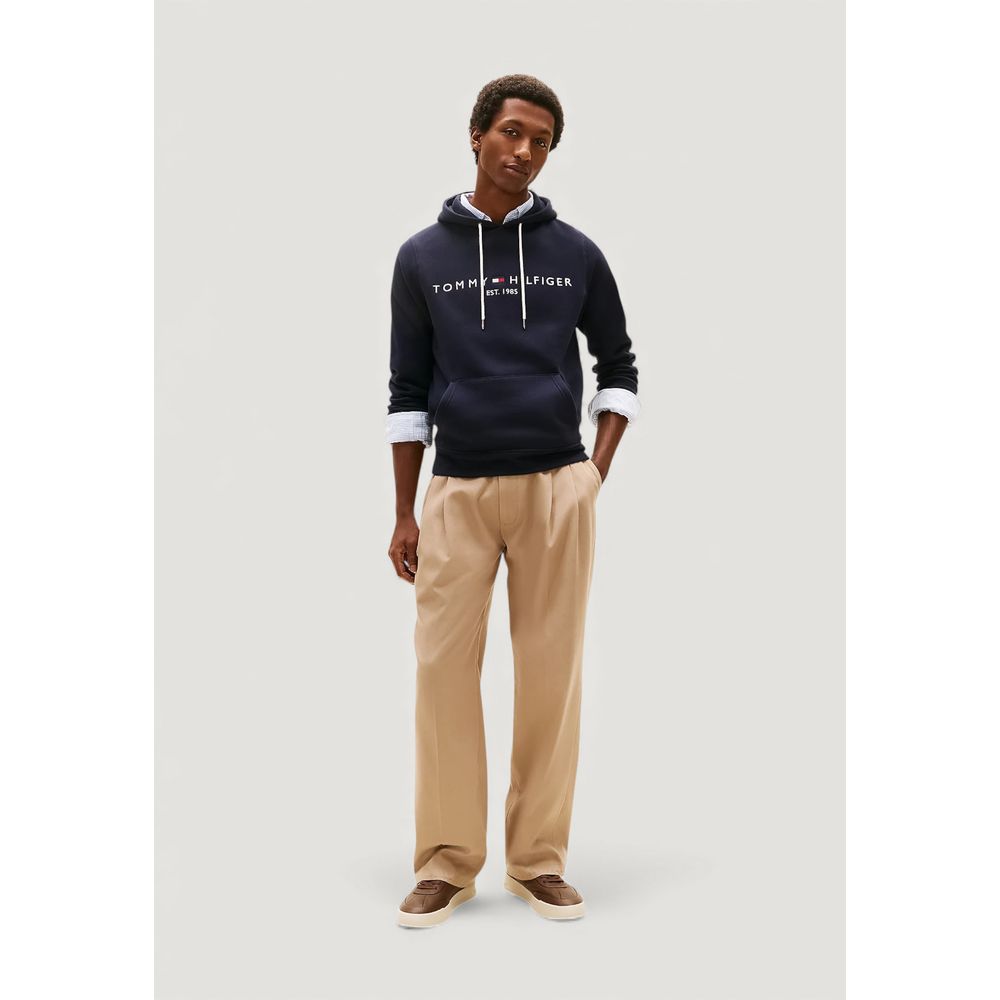 Hooded Hoodie by Tommy Hilfiger for men in cotton blue features a slouchy chic silhouette, detailed with a slouchy chic and a signature hooded neckline for an elevated aesthetic.