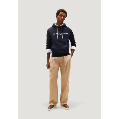 Hooded Hoodie by Tommy Hilfiger for men in cotton blue features a slouchy chic silhouette, detailed with a slouchy chic and a signature hooded neckline for an elevated aesthetic.