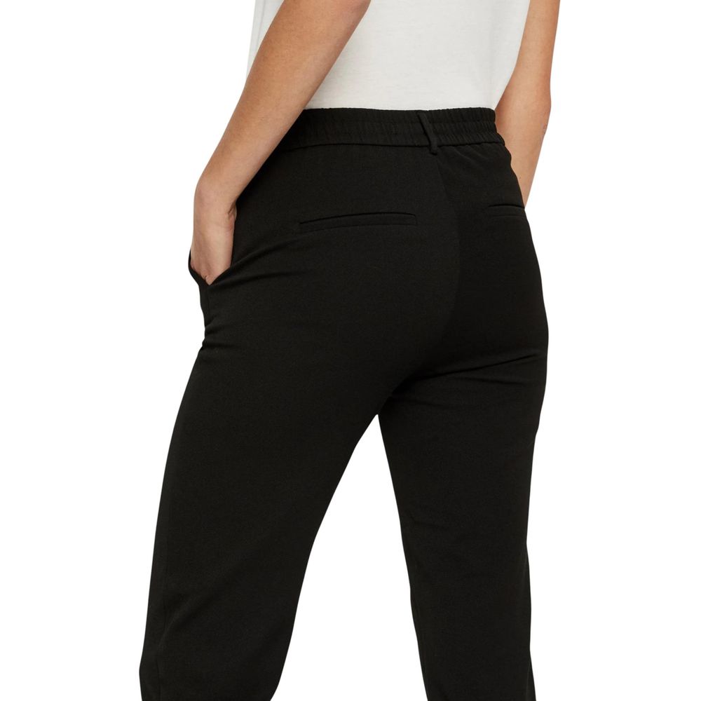 Trousers by Vero Moda for women in stretch viscose polyester black presents a smart silhouette, meticulously detailed with a smart straight-leg & regular-fit, a smart long, and a smart .