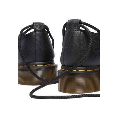 Platform Pumps Heels by Dr. Martens for women in leather & rubber black features an effortlessly chic silhouette from the Women's Leather & Rubber Platform Pumps Heels collection, showcasing a platform and effortlessly chic for a effortlessly chic look.