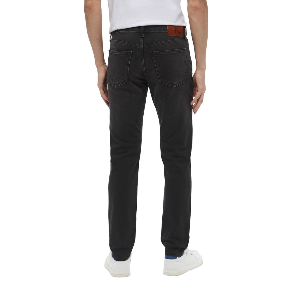 Jeans by Calvin Klein Jeans for men in stretch denim cotton black presents a refined pantology silhouette, artfully defined by a refined pantology skinny & slim, long, and a sophisticated .
