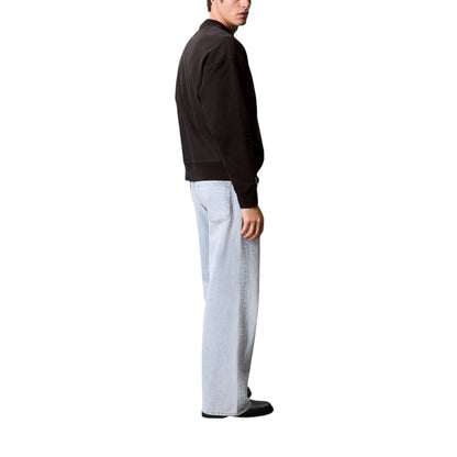 Activewear Sweatshirt by Calvin Klein Jeans for men in polyester cotton terrycloth black presents a sporty silhouette, showcasing a sophisticated crew neckline and detailed with premium for a sporty finish.