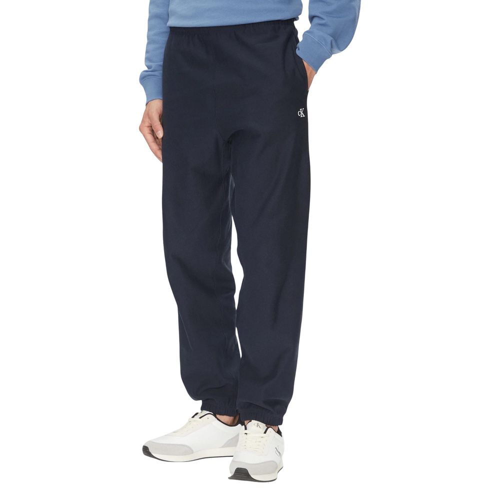 Activewear Jogger Pants by Calvin Klein Jeans for men in polyester cotton terrycloth blue features an sporty with a and long, showcasing sporty .