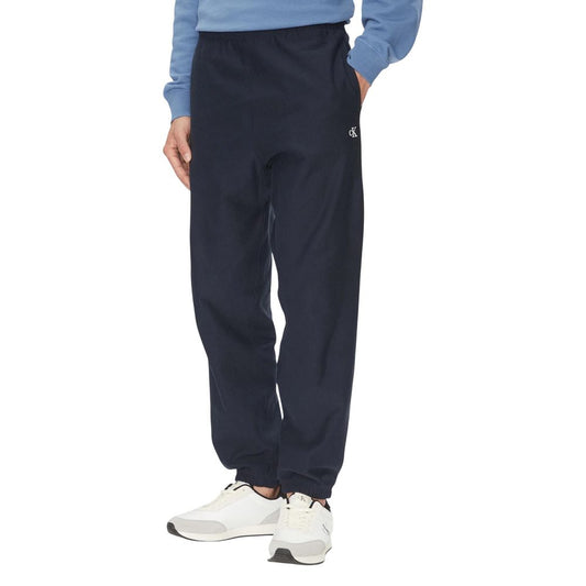 Activewear Jogger Pants by Calvin Klein Jeans for men in polyester cotton terrycloth blue features an sporty with a and long, showcasing sporty .