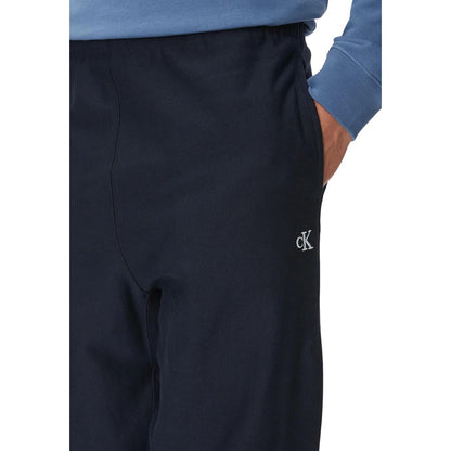 Activewear Jogger Pants by Calvin Klein Jeans for men in polyester cotton terrycloth blue features an ergonomic and with a ergonomic long, showcasing innovative for a ergonomic look.