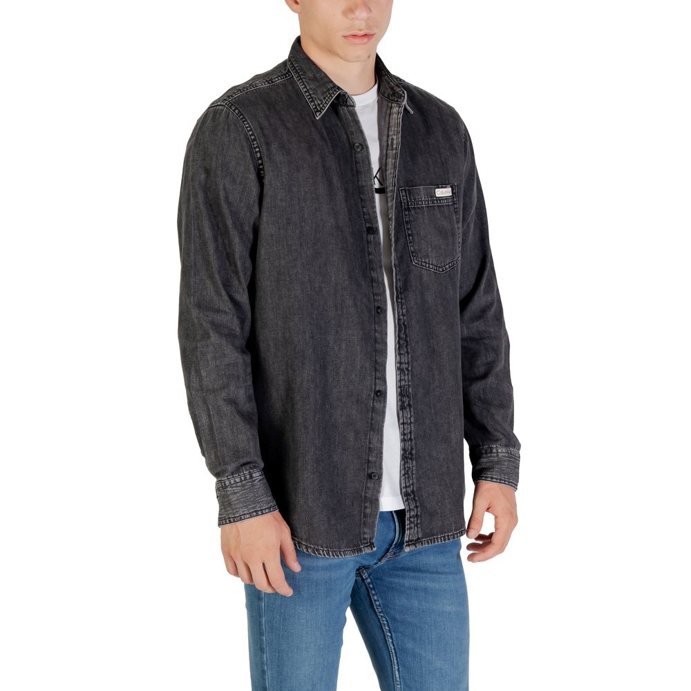 Shirt by Calvin Klein Jeans for men in denim cotton black showcases a sleek silhouette, elegantly detailed with a sleek and for a sleek finish.