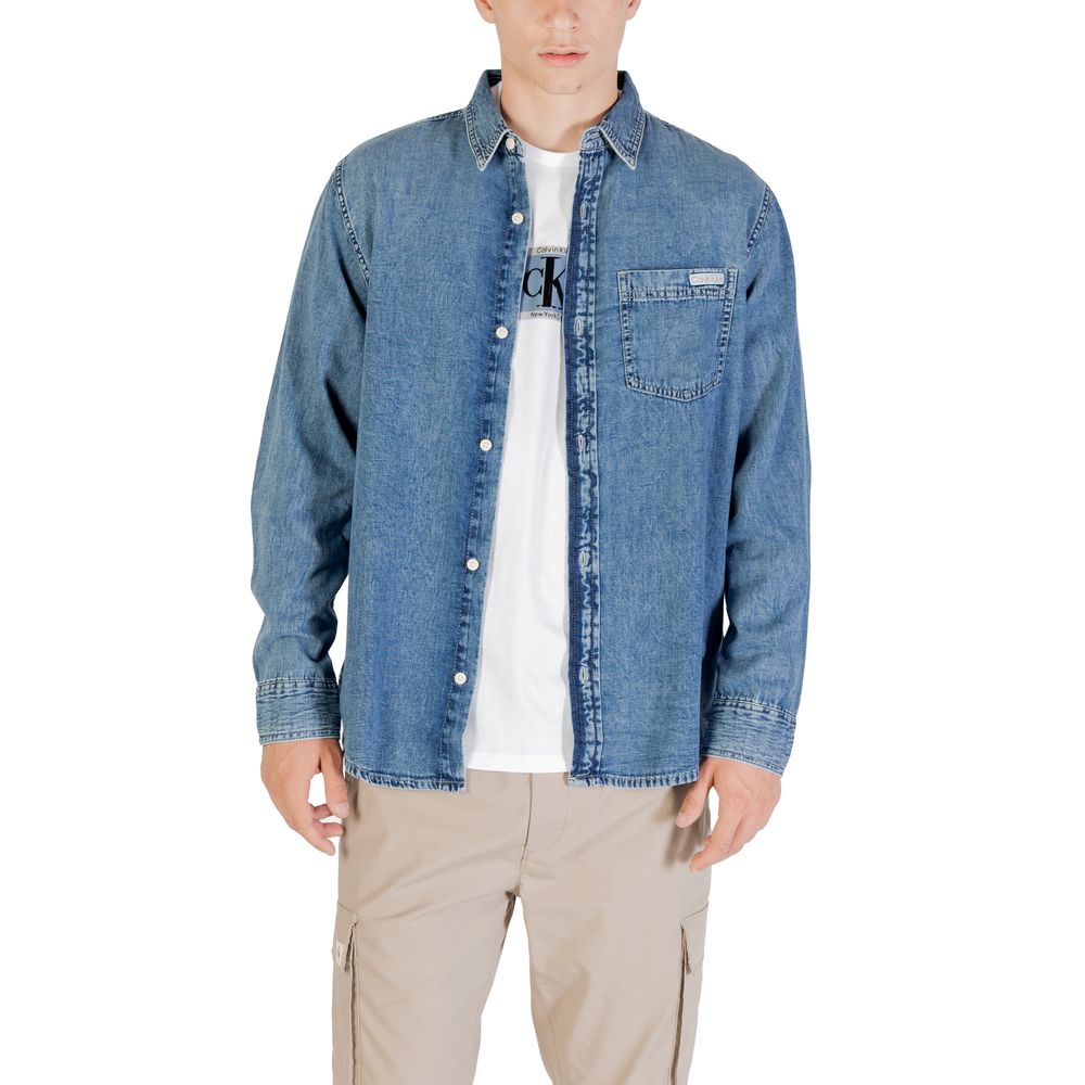 Shirt by Calvin Klein Jeans for men in denim cotton blue presents a discerning silhouette, showcasing a sophisticated round neckline and for a truly discerning finish.