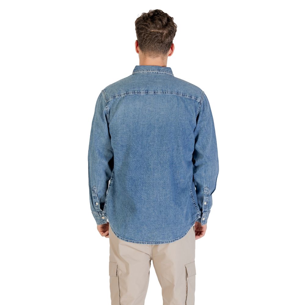 Shirt by Calvin Klein Jeans for men in denim cotton blue showcases a sharp silhouette, elegantly detailed with a sharp round neckline and sharp .