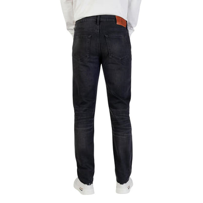 Jeans by Calvin Klein Jeans for men in stretch denim cotton blue presents a refined pantology silhouette, artfully defined by a refined pantology tapered-leg, skinny & slim, long, and a sophisticated .