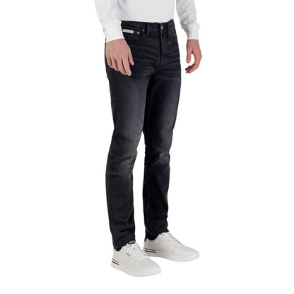 Jeans by Calvin Klein Jeans for men in stretch denim cotton blue presents a tailored silhouette, showcasing a tailored tapered-leg, skinny & slim and long cut with a refined for a truly tailored aesthetic.