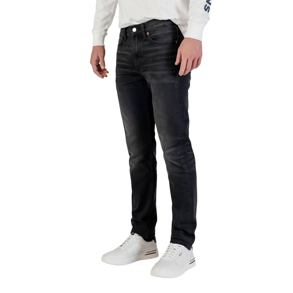 Jeans by Calvin Klein Jeans for men in stretch denim cotton blue features a polished silhouette with a polished tapered-leg, skinny & slim, reaching a polished long and finished with a polished .