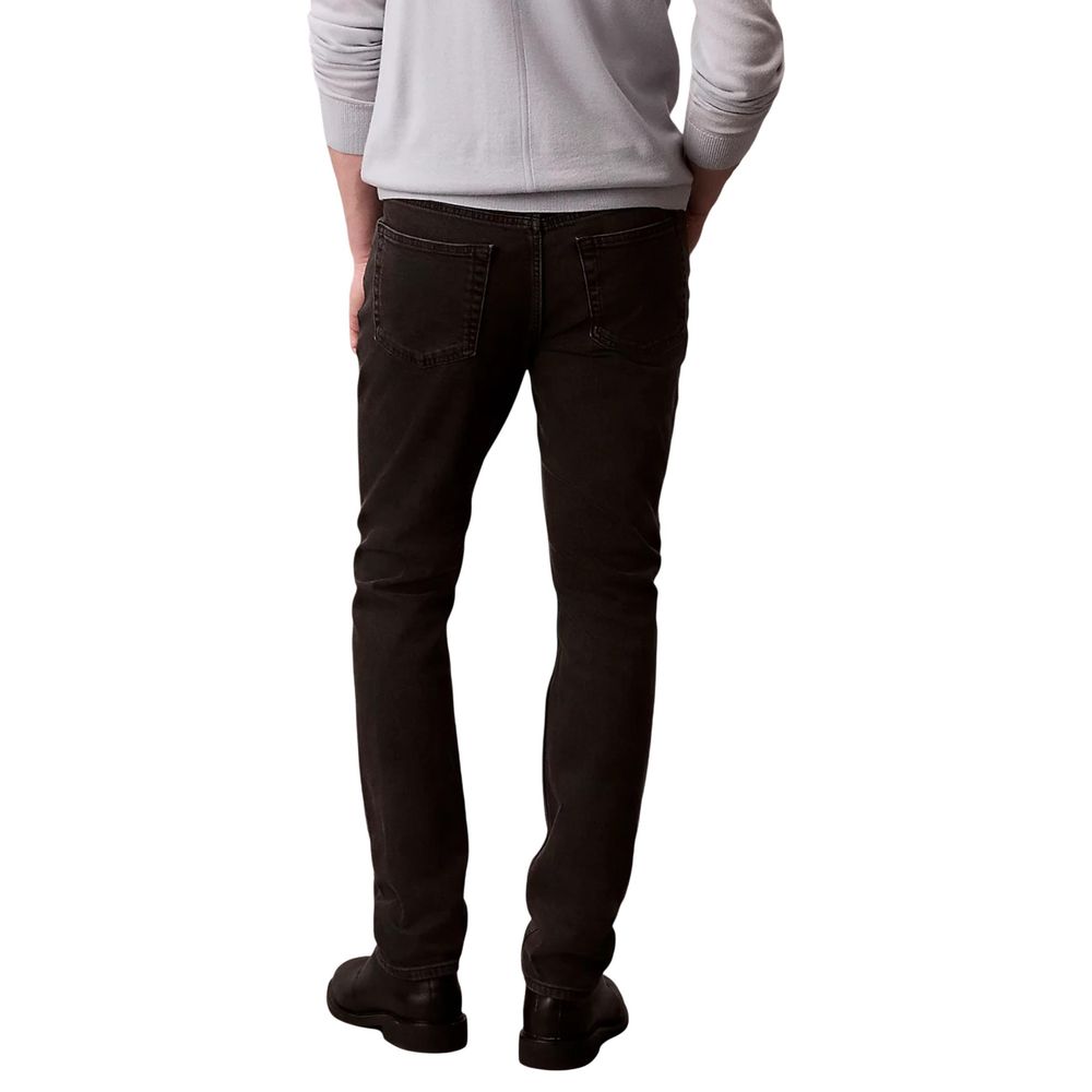 Jeans by Calvin Klein Jeans for men in stretch denim cotton black features an sartorial skinny & slim and long with a cut for a sartorial finish.